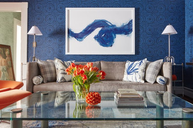 Small trendy enclosed carpeted and blue floor living room photo in Boston with blue walls, a standard fireplace and a wood fireplace surround