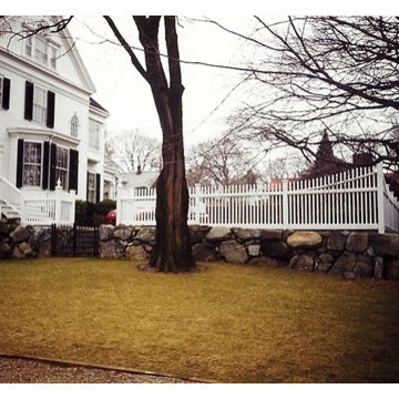 Cedar Chestnut Hill Fence on Retaining Wall