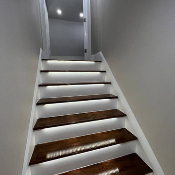 Modern Staircase Transformation with LED Lighting by Sun Shore Construction