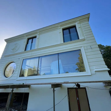 Facade profiles around the circular and rectangular windows.
