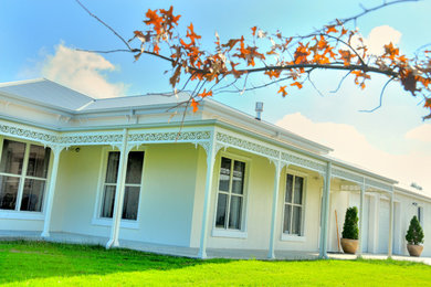 Photo of a country home design in Melbourne.