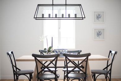 This is an example of a transitional dining room in Brisbane.
