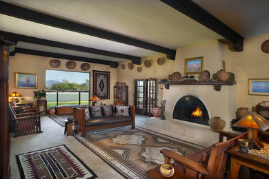 Living room - huge southwestern carpeted living room idea in Phoenix with a standard fireplace, a tile fireplace and yellow walls
