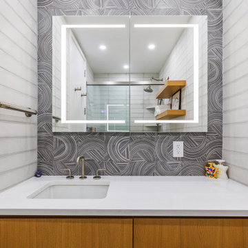 POWERFULLY DESIGNED BATHROOM PACKS A PUNCH.