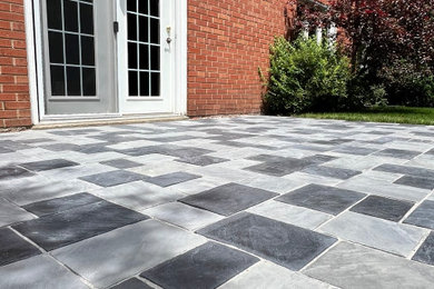 Large backyard brick patio photo in Toronto with a bbq area