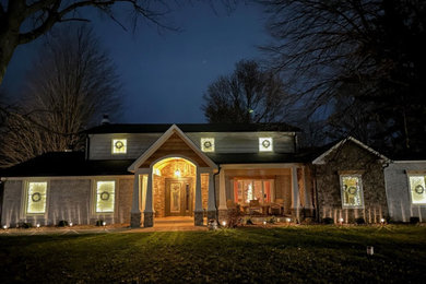 Example of an arts and crafts one-story brick exterior home design in Indianapolis with a shingle roof and a black roof