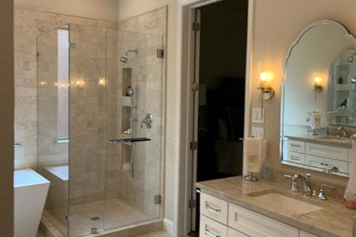Bathroom - large transitional master marble tile marble floor bathroom idea in Dallas with shaker cabinets, white cabinets, an undermount sink, quartzite countertops, a hinged shower door and a built-in vanity