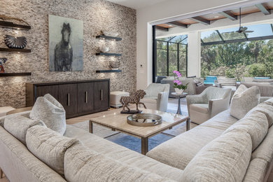 Transitional light wood floor and beige floor living room photo in Miami with white walls