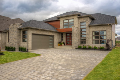 Trendy gray two-story exterior home photo in Toronto
