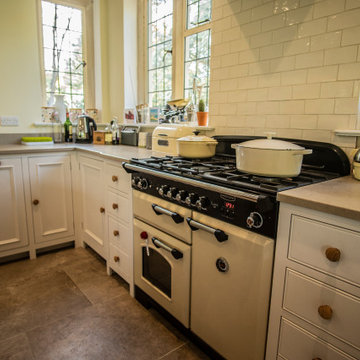 Traditional, bright kitchen with upcycled island