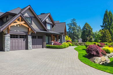 Inspiration for a large modern gray two-story mixed siding house exterior remodel in Nashville with a mixed material roof