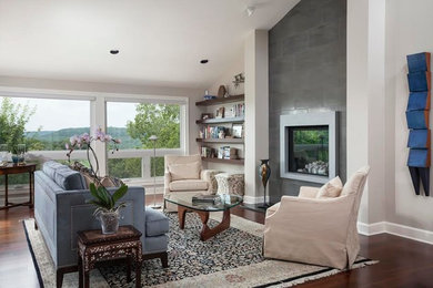 Inspiration for a large transitional formal and open concept medium tone wood floor living room remodel in Austin with gray walls, a standard fireplace, a metal fireplace and no tv