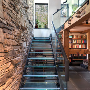 Contemporary glass l-shaped staircase in Other with open risers.