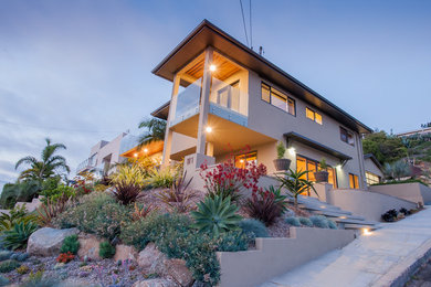 Design ideas for a large modern full sun front yard concrete paver landscaping in San Diego for summer.