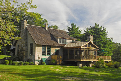 Rustic brown two-story wood exterior home idea in Bridgeport with a shingle roof