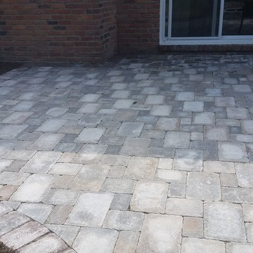 Unilock Brussels Patio w/ an Oaks Colonnade Border & Unilock Seat Wall & Firepit