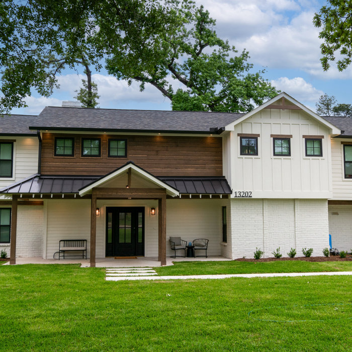 This was a full exterior rebuild due to 1 tree falling on the house and a second tree falling on the garage.  The exterior features 4 different types of siding including prefinished stained siding by
