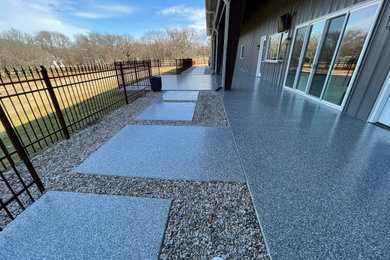 Large urban backyard concrete patio photo in Dallas