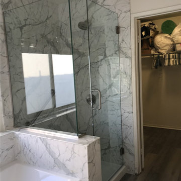 Calcutta Marble simulated stone shower w/ pony wall