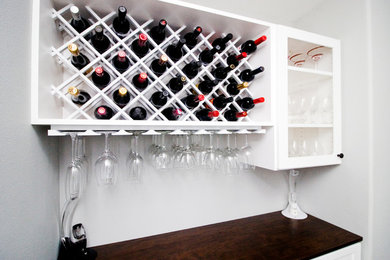 Photo of a small wine cellar in Seattle with storage racks.