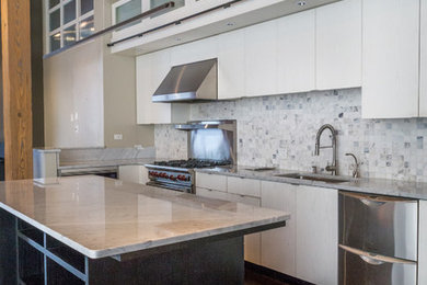 Example of a mid-sized minimalist l-shaped dark wood floor and brown floor open concept kitchen design in Chicago with an undermount sink, flat-panel cabinets, white cabinets, granite countertops, gray backsplash, stainless steel appliances and an island