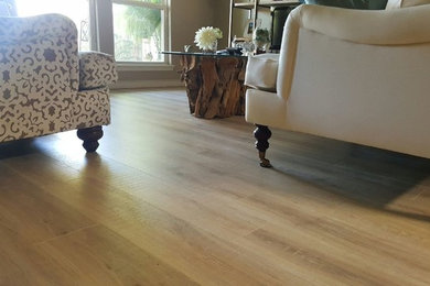 Example of a mid-sized cottage chic open concept vinyl floor and beige floor living room design in Austin