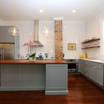 Open shelving and exposed brick are among the many details that encompass the si