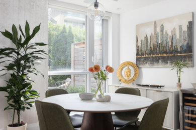 Example of a mid-century modern dining room design in Toronto