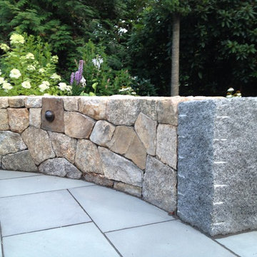 New England fieldstone wall with granite end post