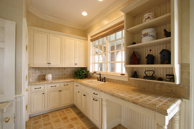Entryway - traditional ceramic tile entryway idea in DC Metro with beige walls