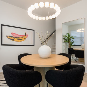 Modern Dining: Round Table & Black Chairs