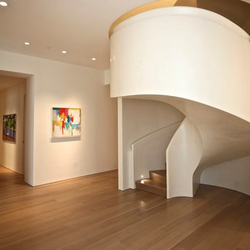 Pearlized shell Venetian plaster finish on stairwell walls.