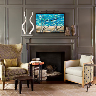 Traditional study in Orange County with a standard fireplace and a metal fireplace surround.