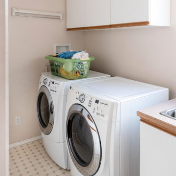 Laundry rooms with Oxford White Shaker cabinets