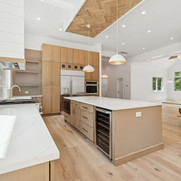 Warm Modern Kitchen with Custom Island and Wood-Inlaid Ceiling