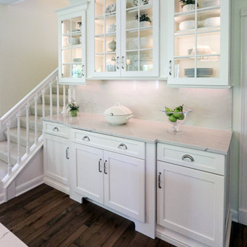 White Kitchen with Gray Quartz Countertops, Farmhouse Sink and Hardwood Floors