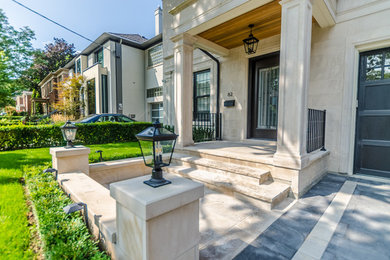 Photo of a mid-sized modern partial sun front yard concrete paver landscaping in Toronto for summer.