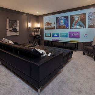 This is an example of a large contemporary enclosed home cinema in Louisville with grey walls, carpet, a projector screen and grey floors.