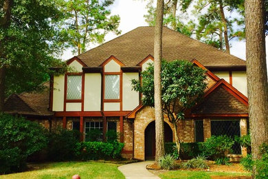 Mid-sized craftsman beige two-story mixed siding house exterior idea in Houston with a clipped gable roof and a shingle roof