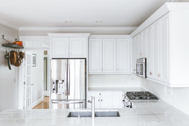 Inspiration for a mid-sized kitchen in Charlotte with raised-panel cabinets, white cabinets and no island.