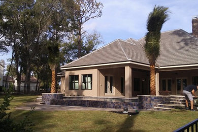 Photo of a tropical home design in Orlando.