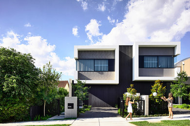 Photo of a contemporary black duplex exterior in Melbourne.