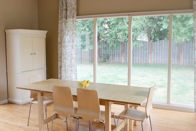 Inspiration for a mid-sized traditional dining room in Boston with beige walls.