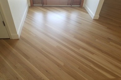 Mid-sized elegant light wood floor hallway photo in Sacramento