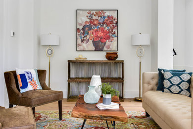 Living room - small transitional open concept light wood floor and beige floor living room idea in Orlando with white walls