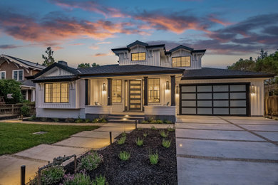 Transitional two-story concrete fiberboard and board and batten exterior home idea in San Francisco with a shingle roof