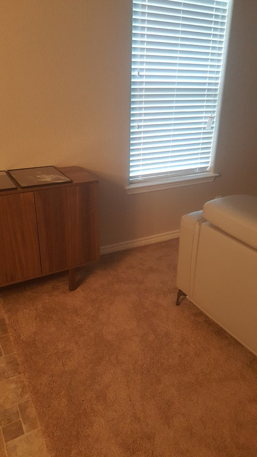 How high should I hang my pictures