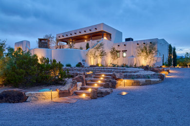 Design ideas for a mid-sized southwestern drought-tolerant and desert front yard gravel landscaping in Other.