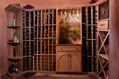 Wine cellar - mid-sized traditional slate floor wine cellar idea in Philadelphia