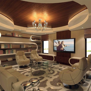 This is an example of a medium sized eclectic open plan home cinema in Miami with beige walls, limestone flooring and a wall mounted tv.